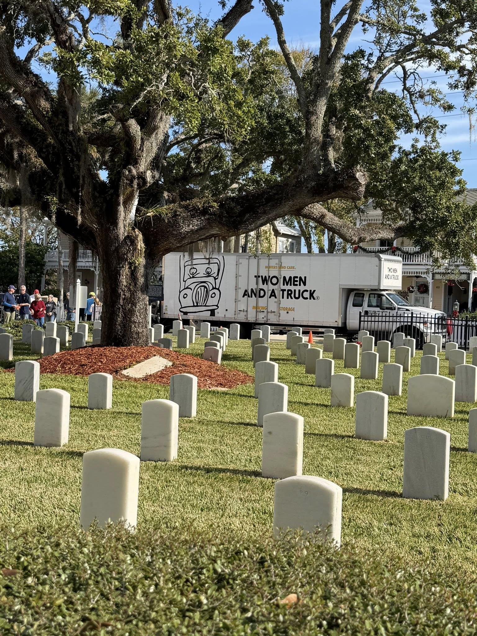 TWO MEN AND A TRUCK® truck at St. Augustine National Cemetery during Wreaths Across America, honoring veterans with the local community.