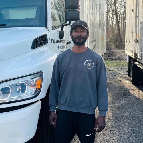 Our driver, Tim, standing next to his moving truck