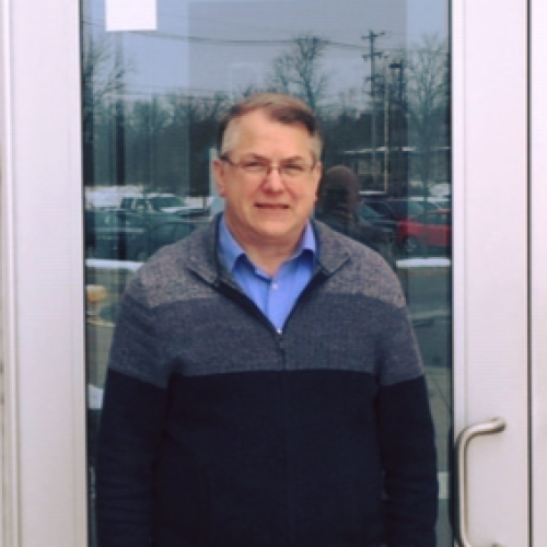 Rich standing in front of out doorway