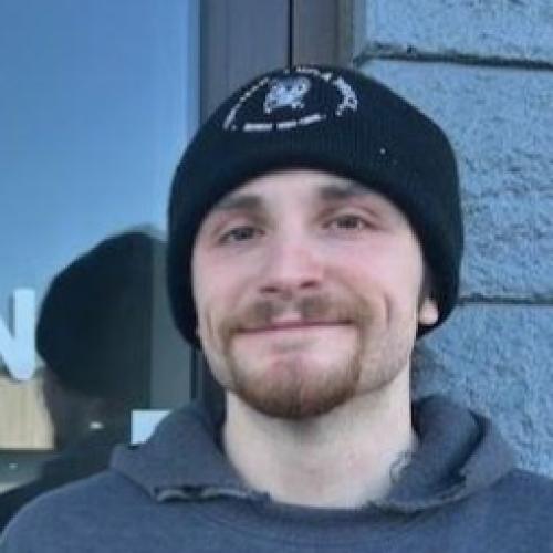 employee standing at the front door