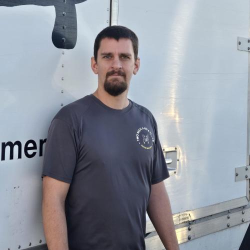 Allen H - standing in front of a truck