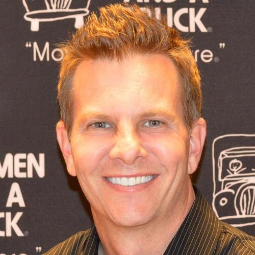 chad standing in front of two men and a truck background