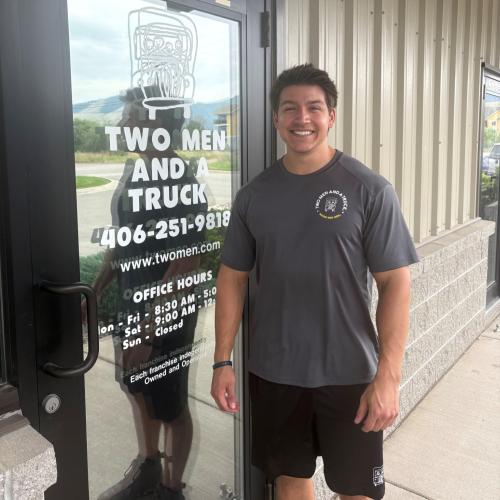Daniel standing in front of door 