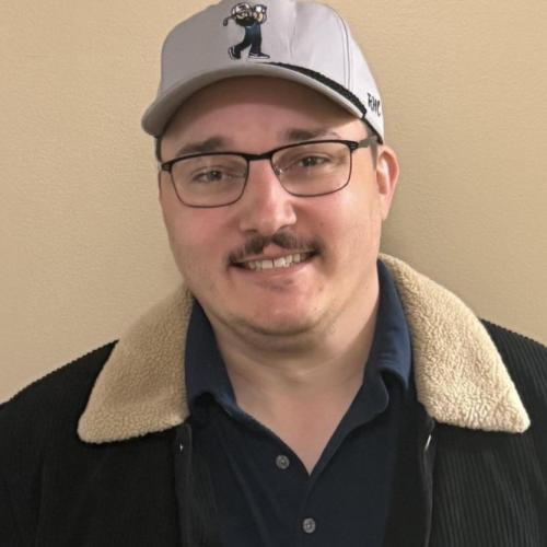 Customer service rep standing by wall