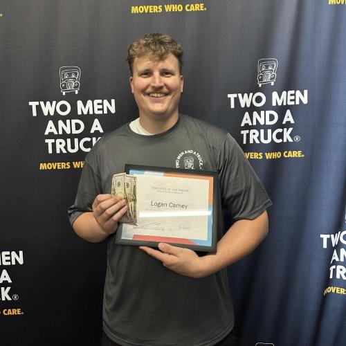 Logan - employee of the month with two men and a truck