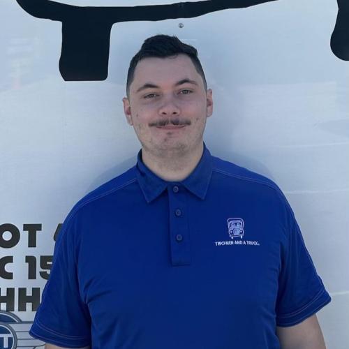 Anthony standing in front of truck