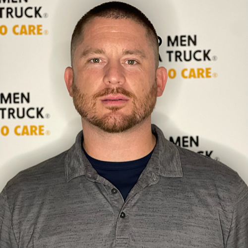 josh standing in front of two men and a truck logo