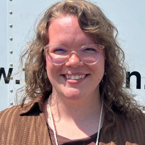 employee pictured in front of moving truck