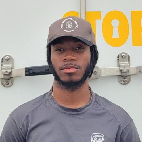 employee pictured in front of moving truck