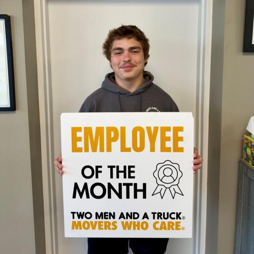 Lukah - employee of the month with two men and a truck