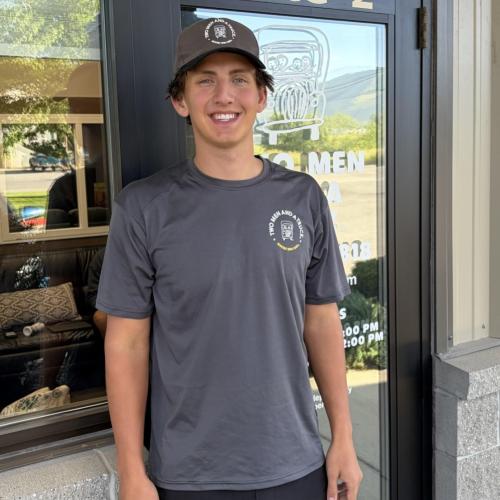 Luke standing in front of Two Men And A Truck door