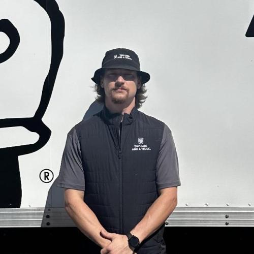 Nate standing in front of a truck