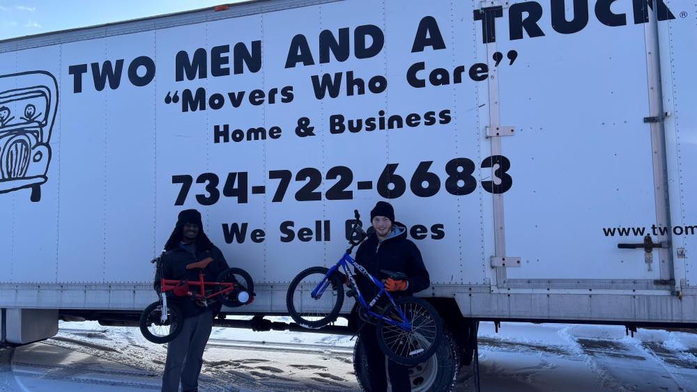 TWO MEN AND A TRUCK Livonia movers moving bikes that were donated for children in need