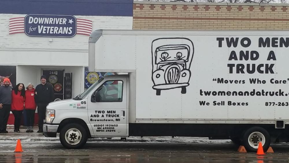 Two Men and a Truck Truck parked in front of the Downriver for Veterans building