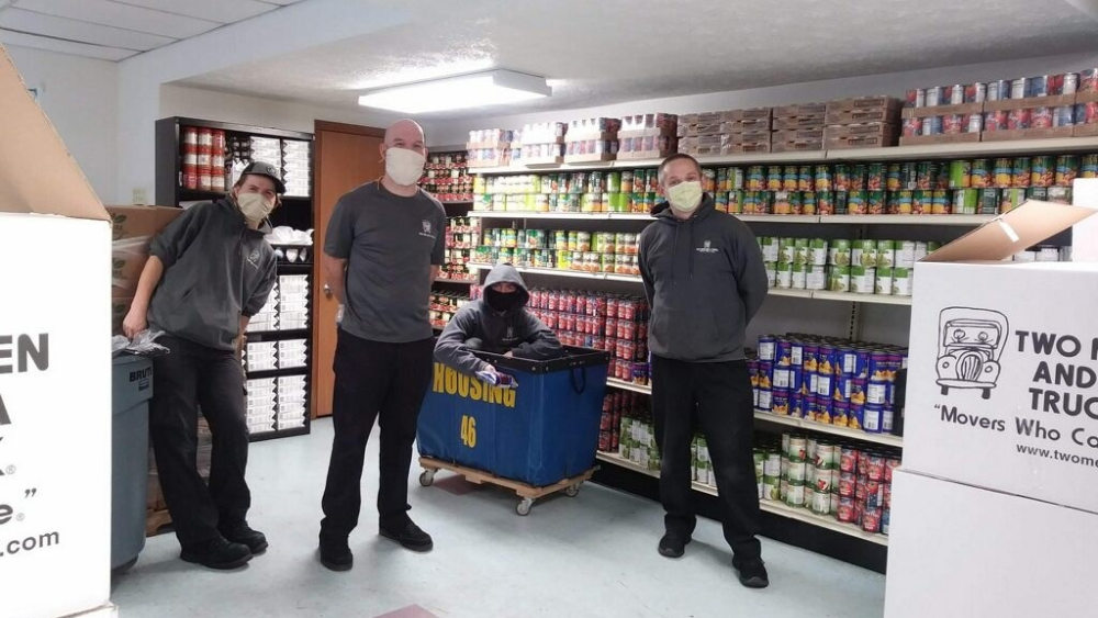 Two Men and a Truck employees lend a hand