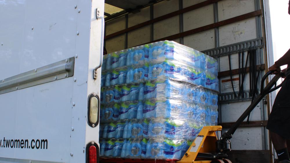 Our truck is delivering food pallets at the food bank