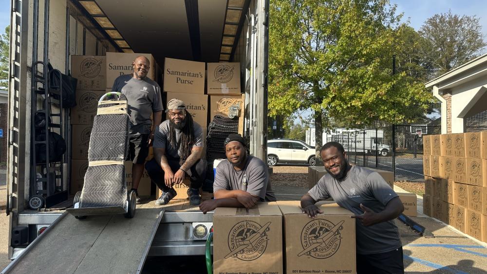 Movers after loading 200 Operation Christmas Child boxes 