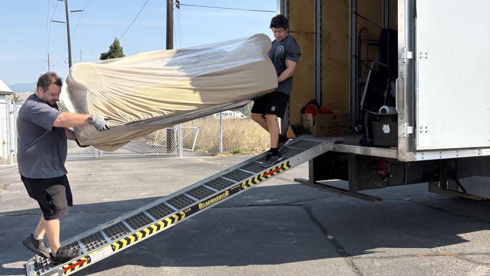 movers taking couch out of moving truck