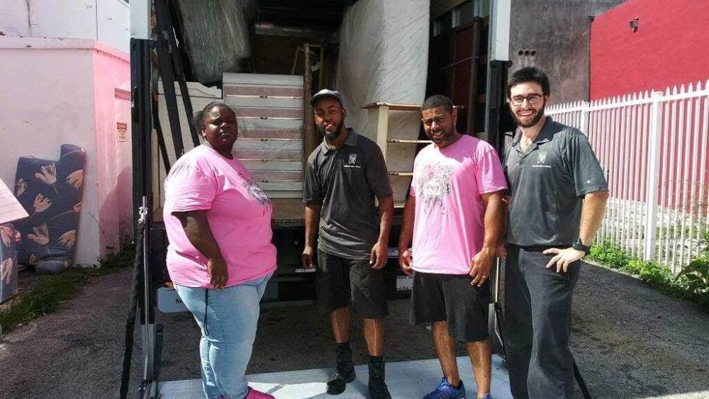 Lotus House staff and movers delivering donations