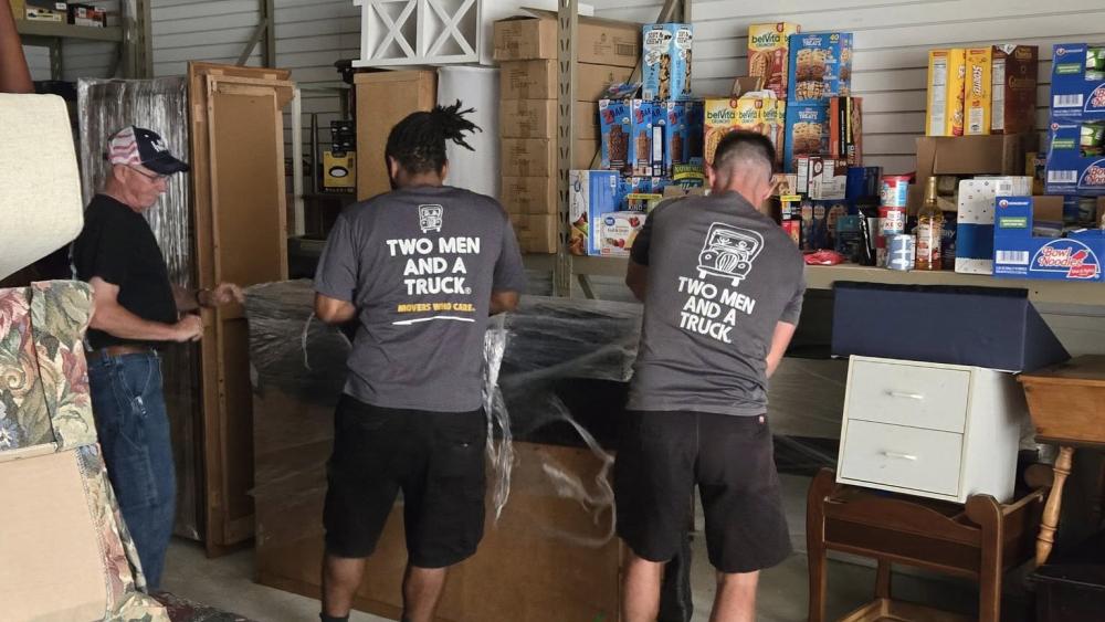 Two Men And A Truck moving donations for Passageways