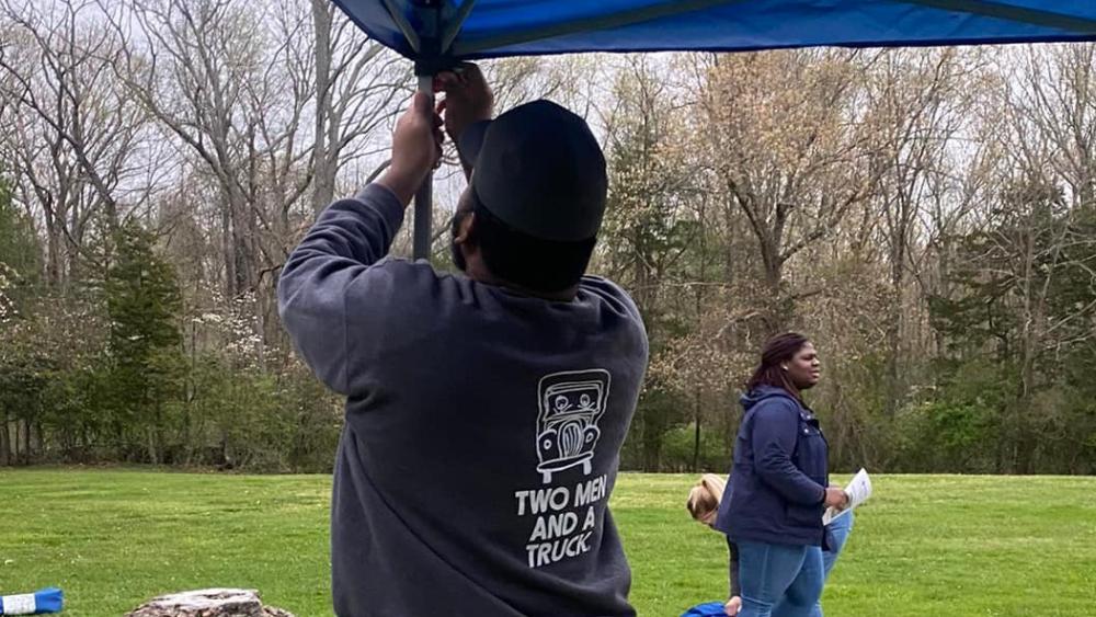 TWO MEN AND A TRUCK driver setting up for a 5K event
