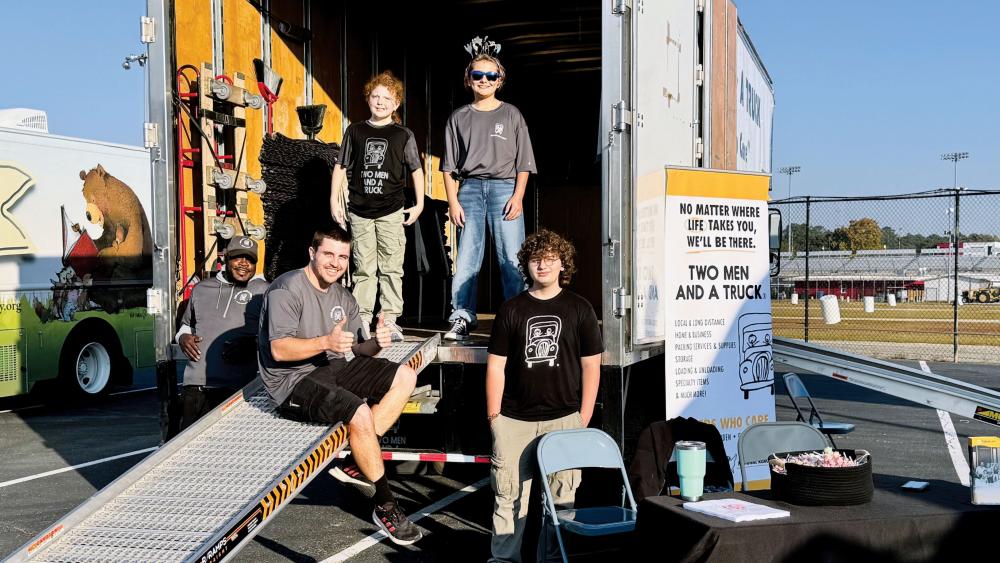 Drivers and Movers Ready to Show off the Moving Truck