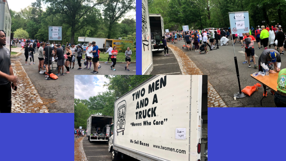 Movers for Two Men and a Truck pictured on the left with their trucks while the runners get their bags checked-in.