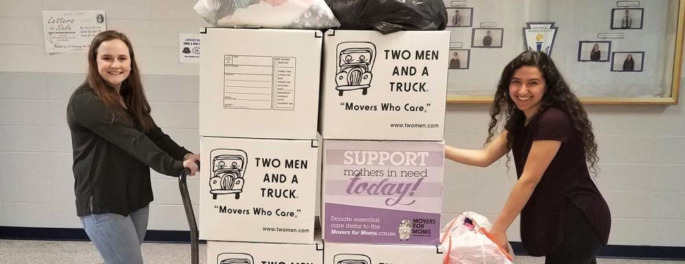 two men and a truck staff with movers for moms items