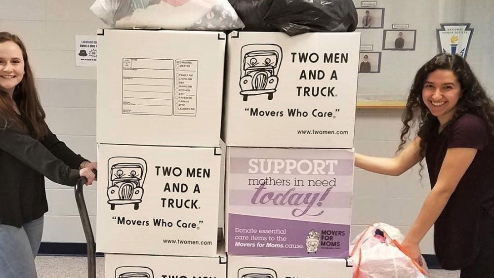 two men and a truck staff with movers for moms items