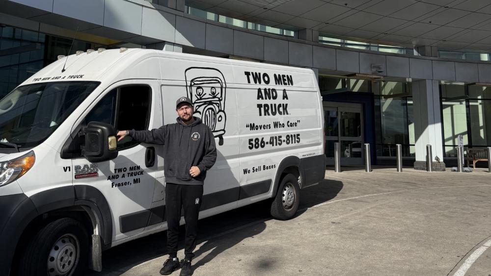 Sir-Rock with Two Men and a Truck in front of the Childrens Hospital 