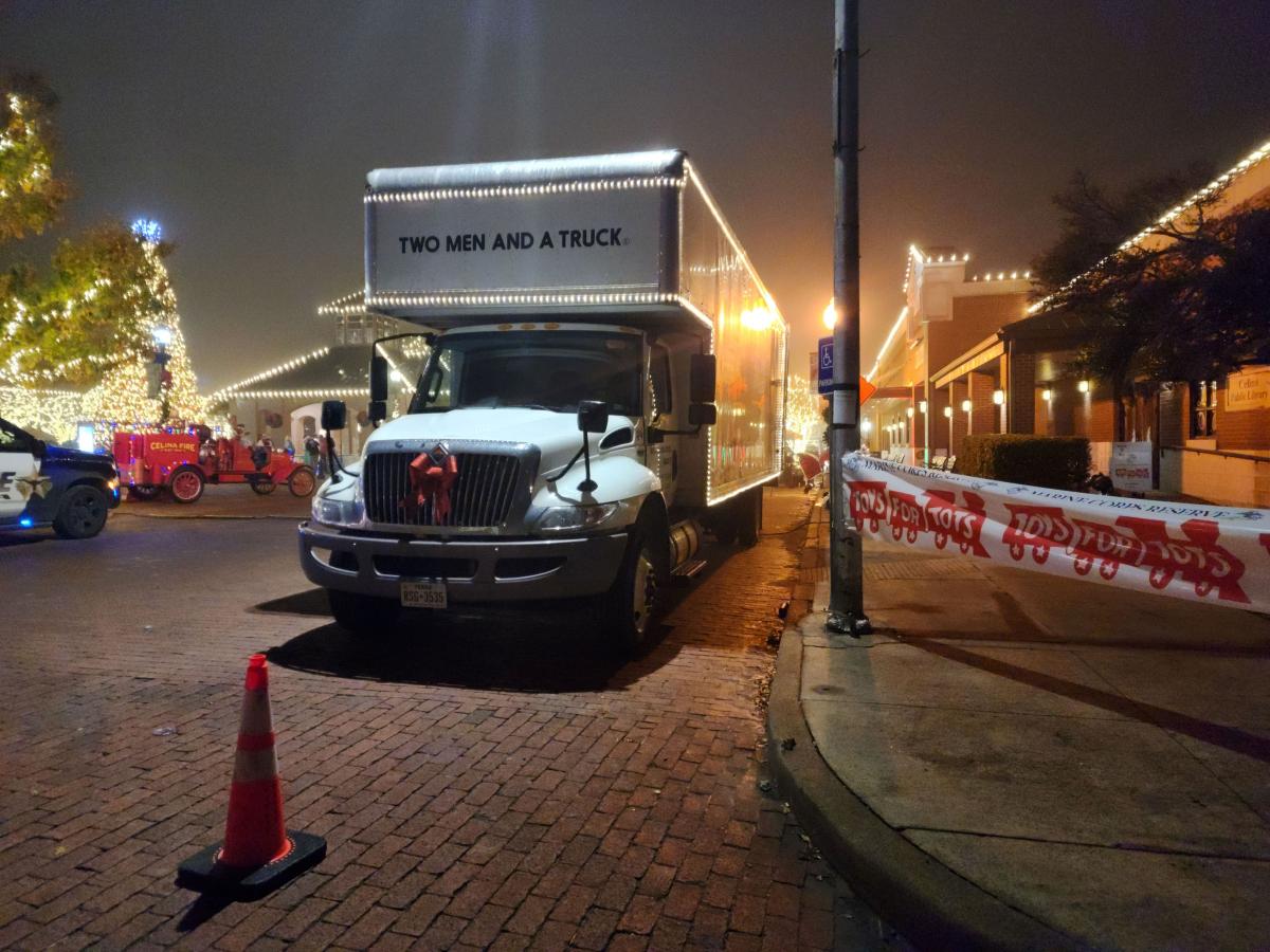 TWO MEN AND A TRUCK, TRUCK IN FRONT OF DOWNTOWN CELINA