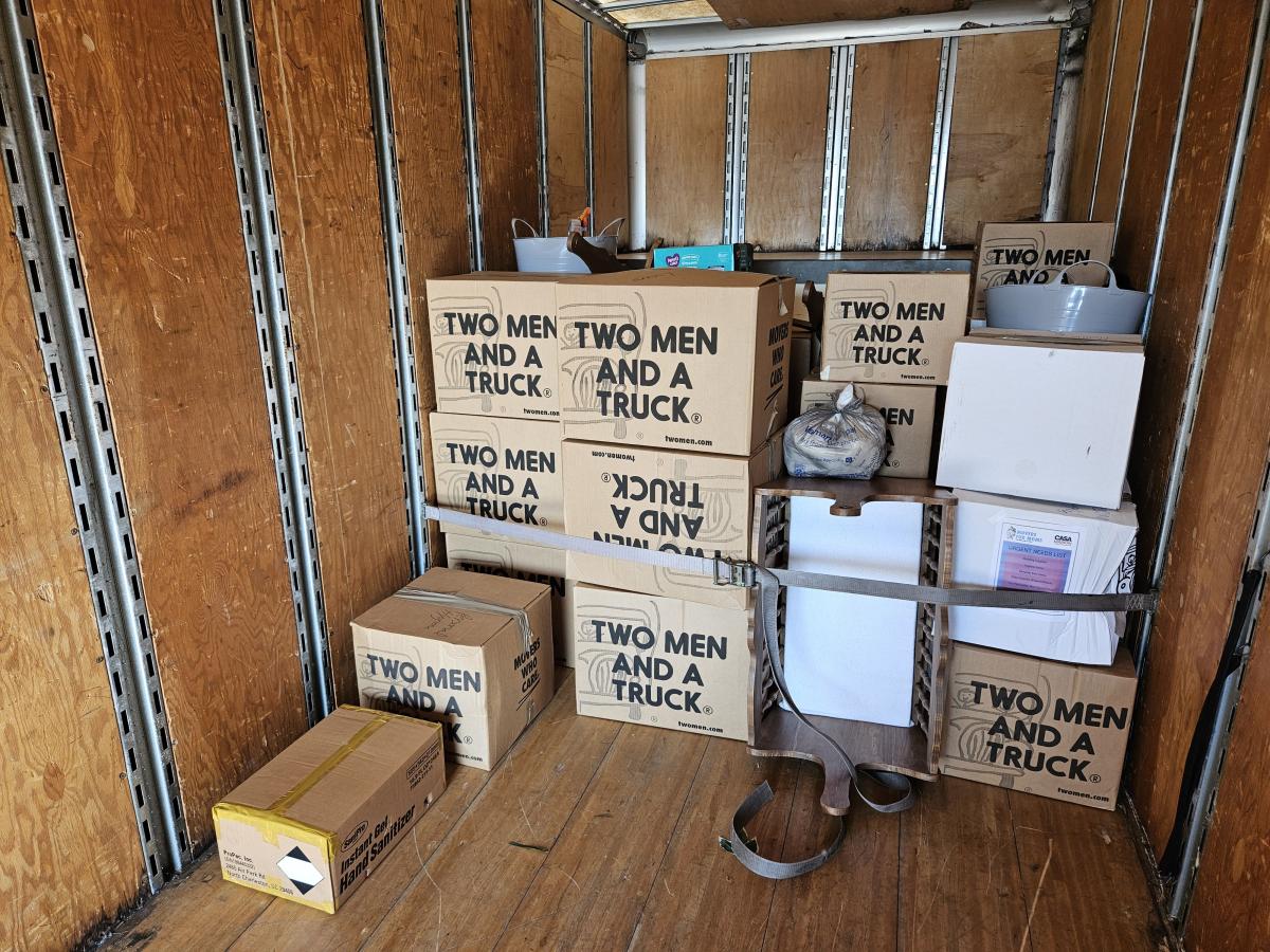 boxes on moving truck strapped in