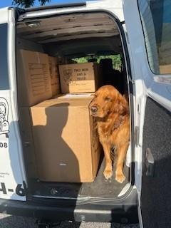 Supervising Boxes of Donations for Movers for Moms
