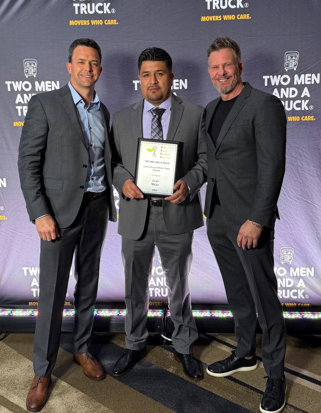 Juan Mejia, Bob Gomori, and Chad Arnold holding Ulimate Move Hero Award