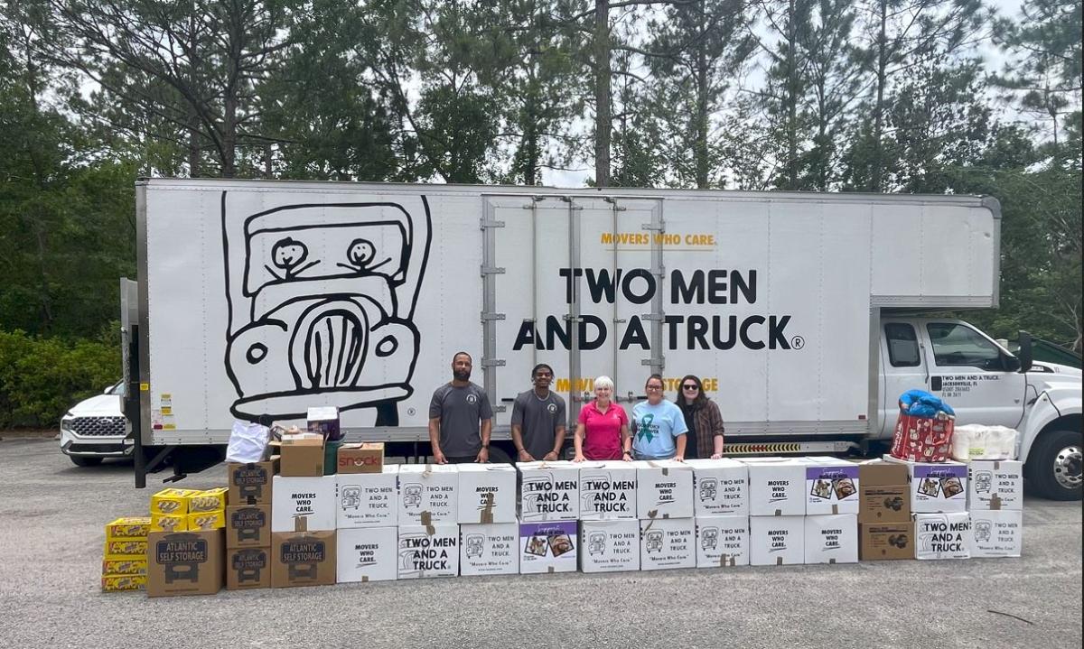 Movers for Moms® 2025 delivery truck at Quigley House with donations collected from schools, Cub Scouts, and community partners.