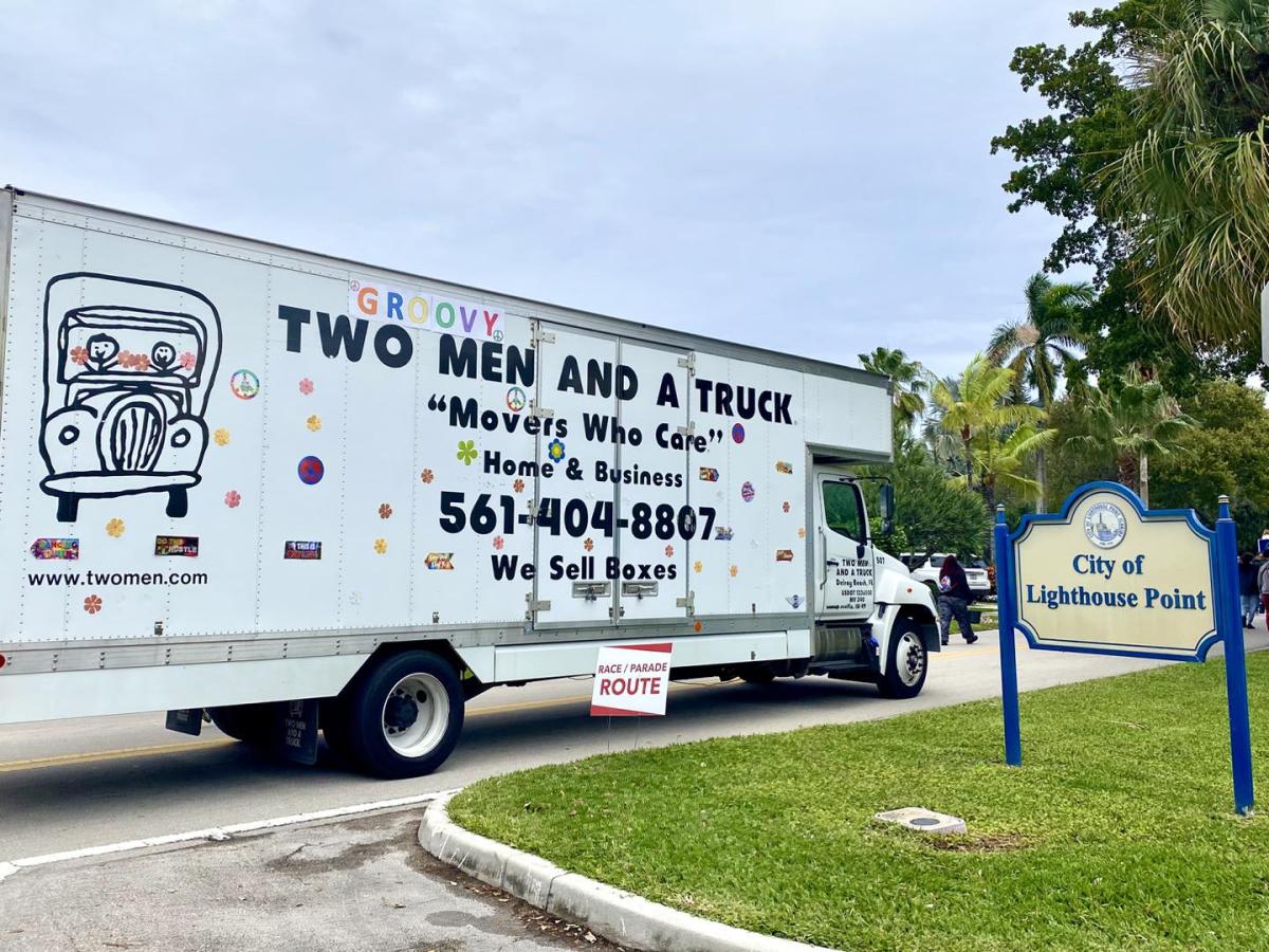 Two Men And A Truck cruising by in the Lighthouse Point Keeper Days Parade Route