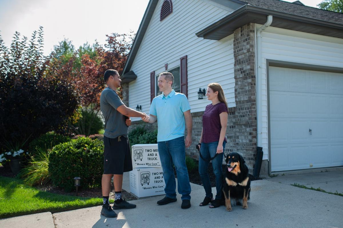 TWO MEN AND A TRUCK mover with customers 