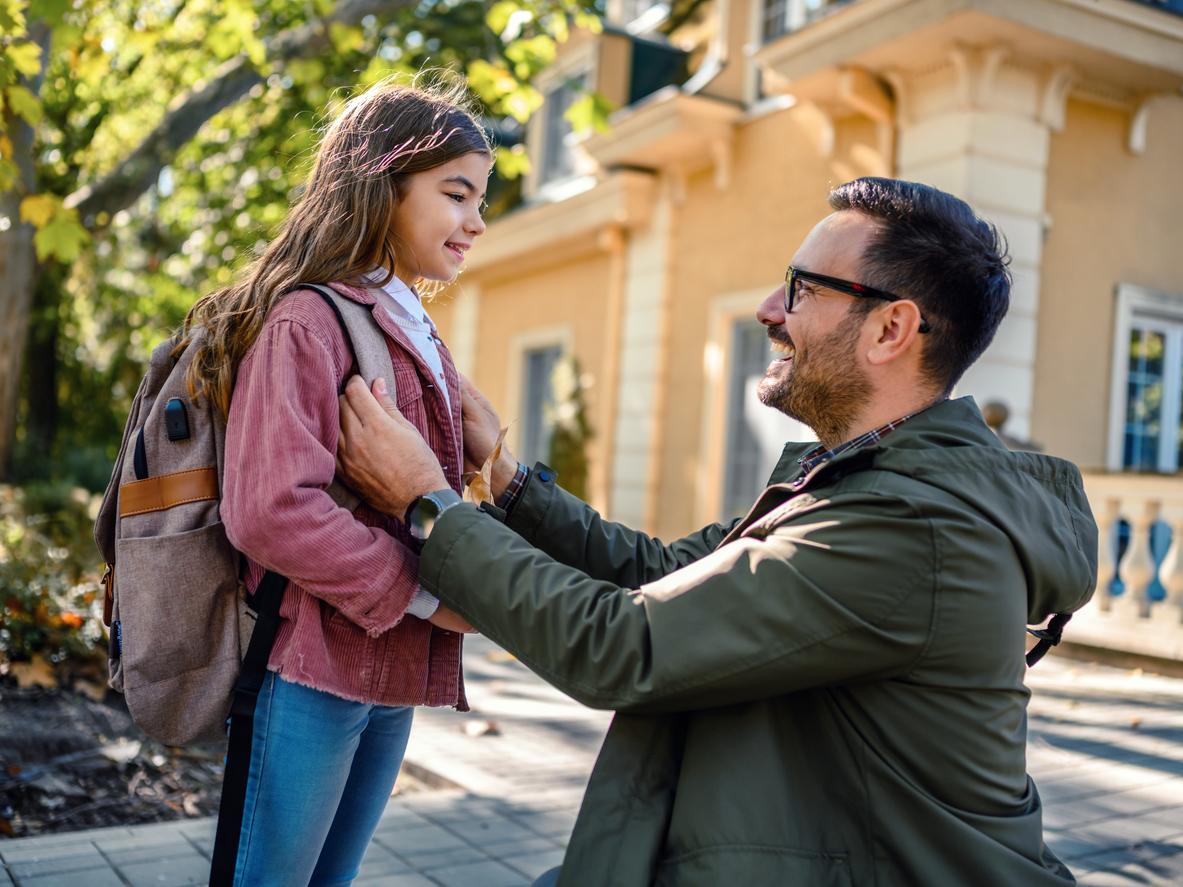 Parent helping their child prepare for a new school year 