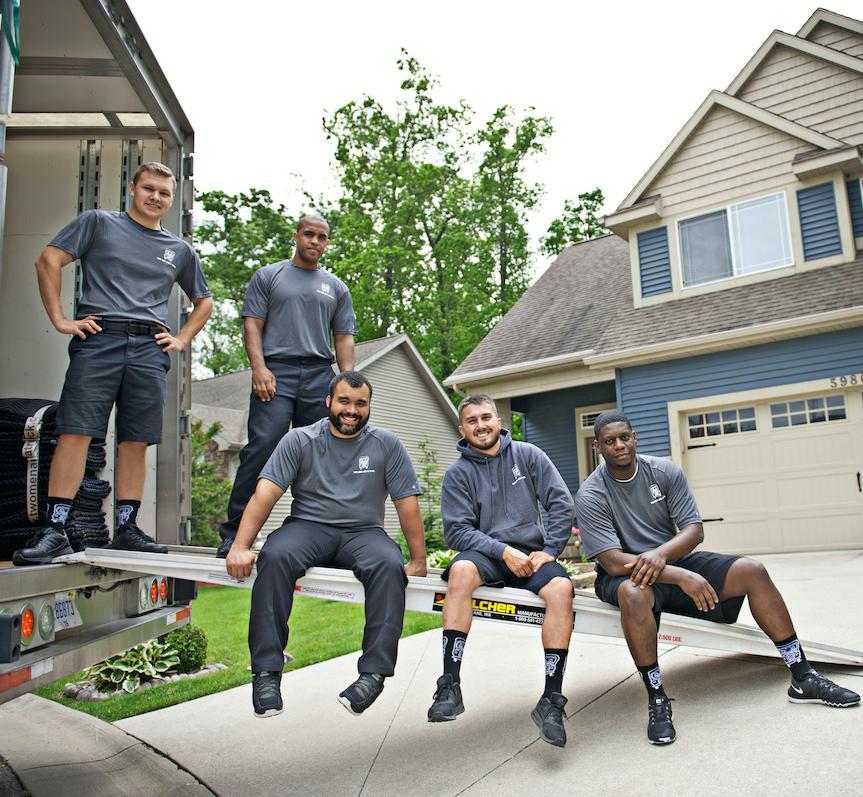 movers sitting on a truck ramp