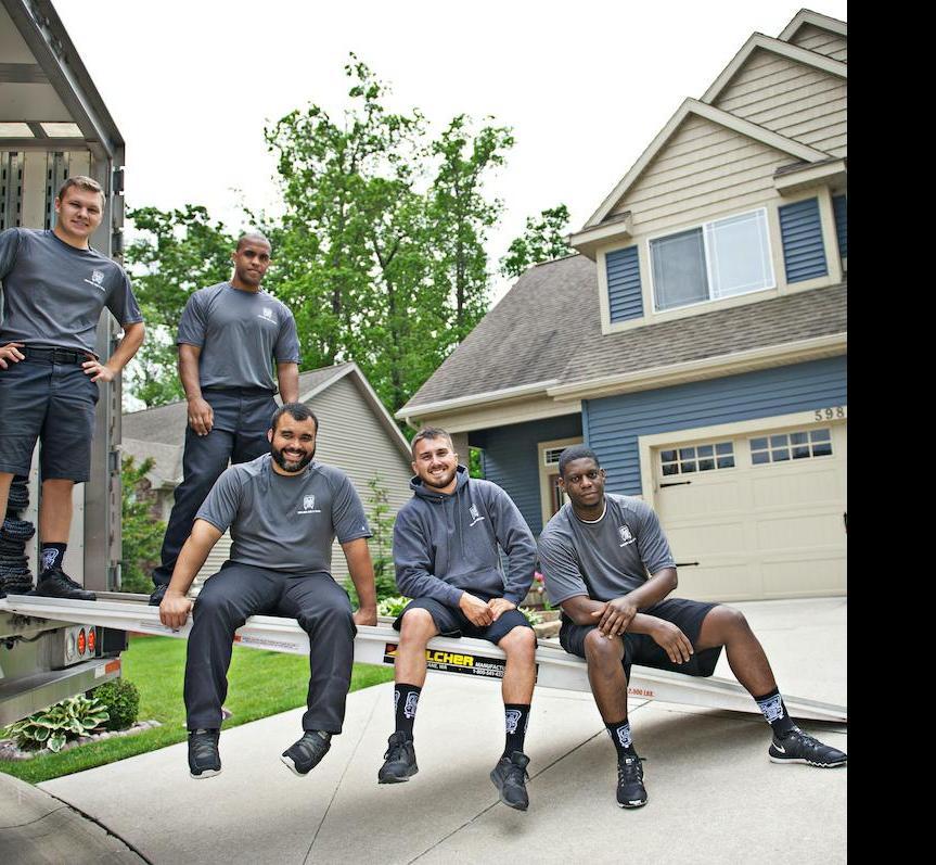 movers sitting on a truck ramp