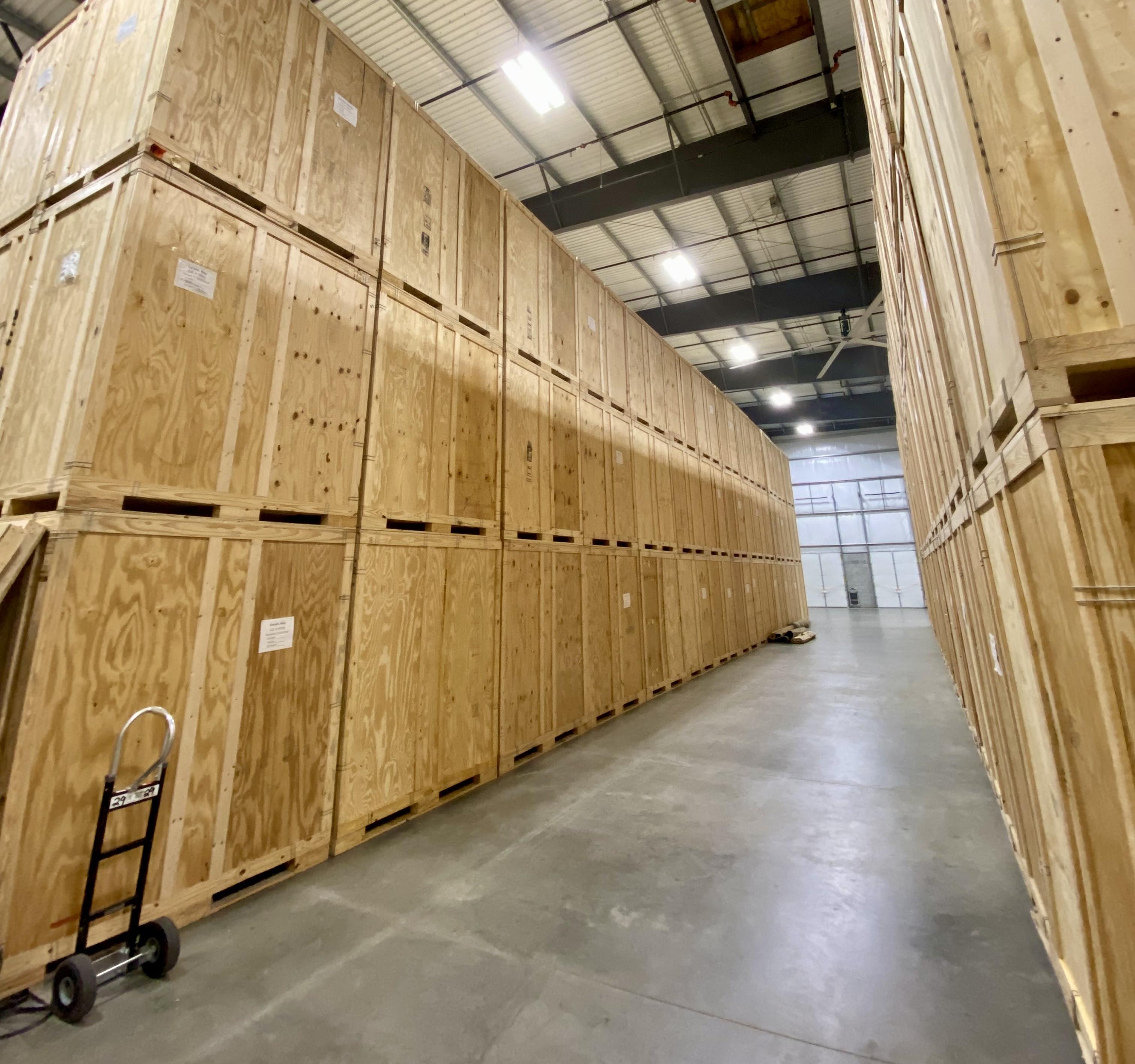 Storage warehouse with crates stacked in an organized manner