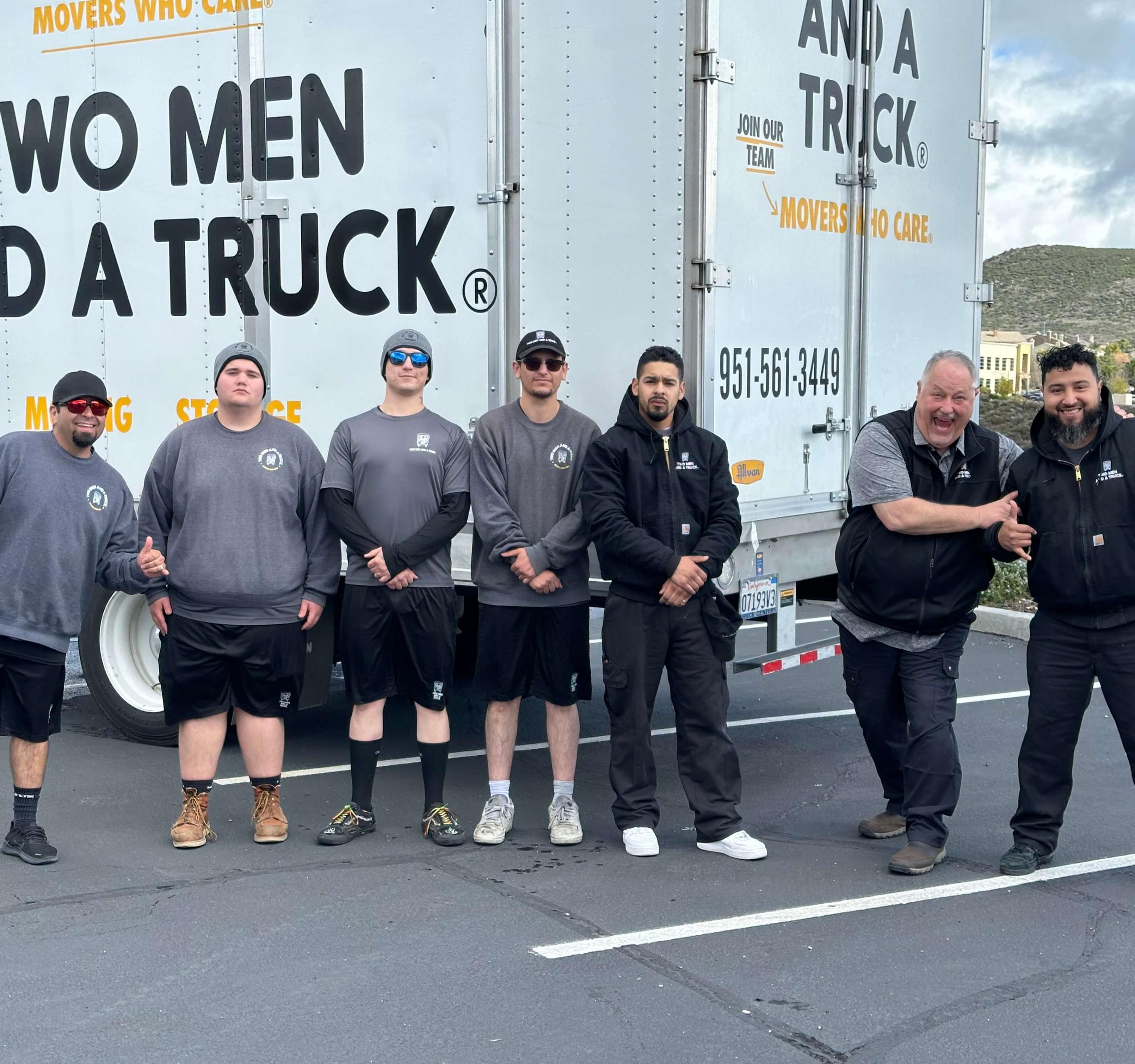 TMT Temecula Valley Moving Team in front of truck.