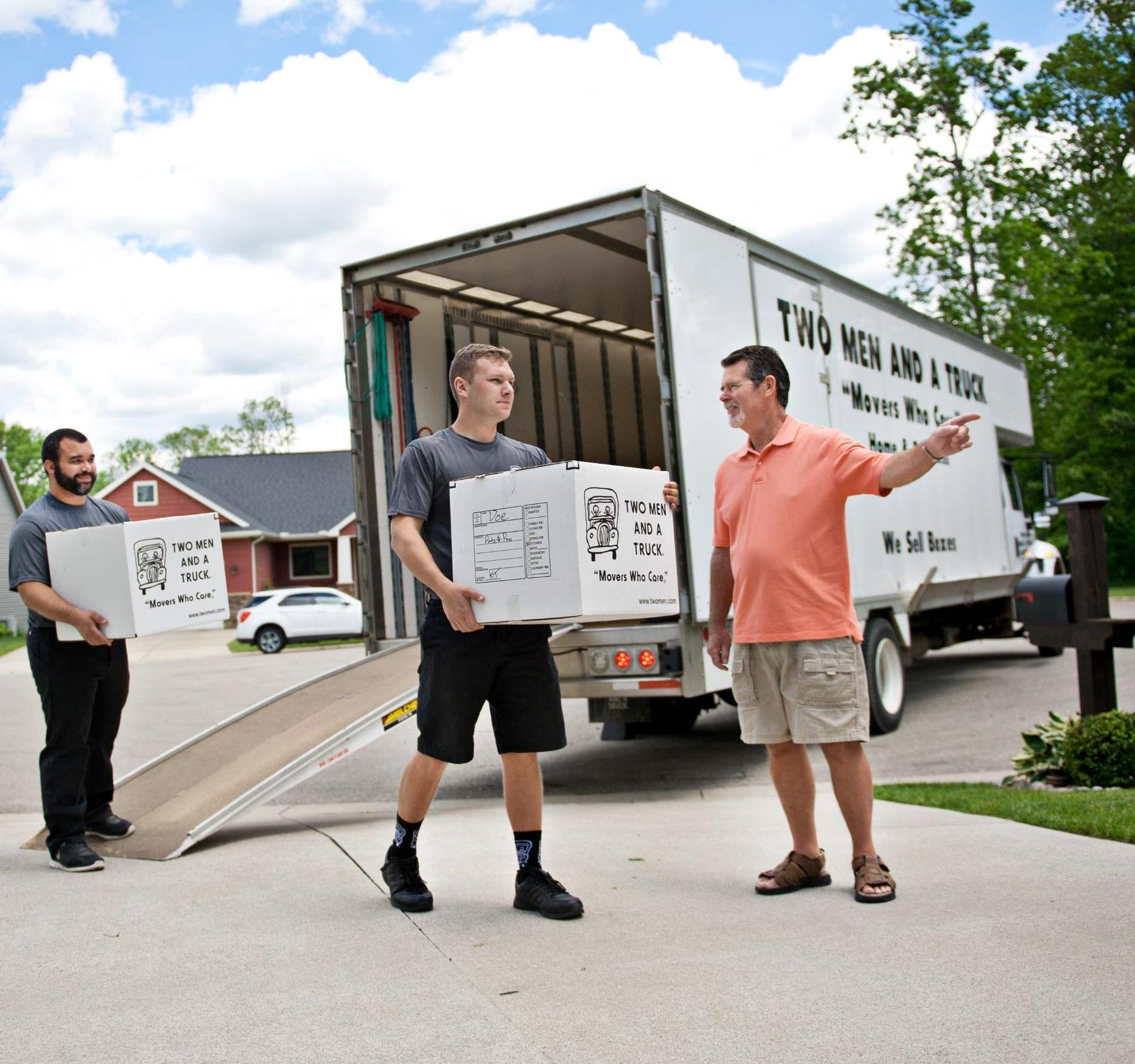 movers unloading a truck at the customer&#039;s direction