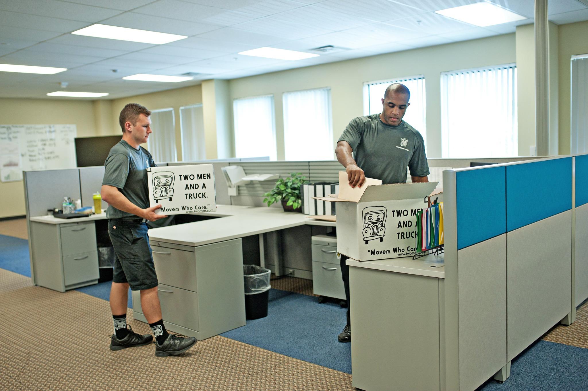 Movers packing up an office