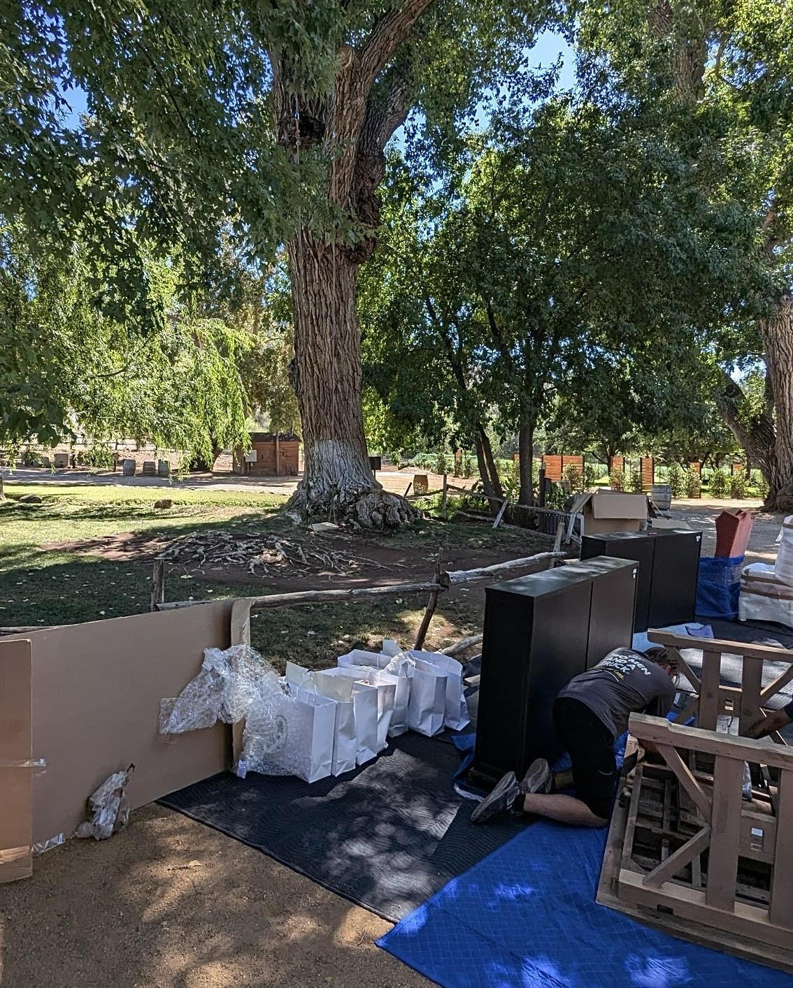 Items laying in groups as movers prepare to set them up for an event