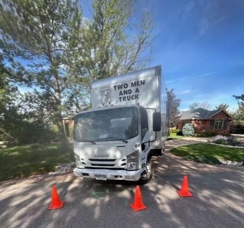 Moving truck parked with safety cones