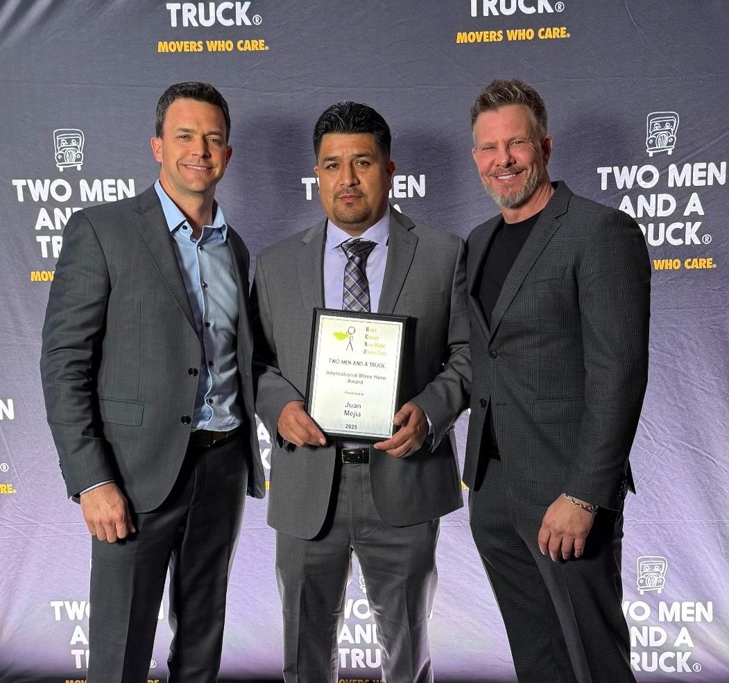 juan mejia, bob gomori, and chad arnold holding move hero award