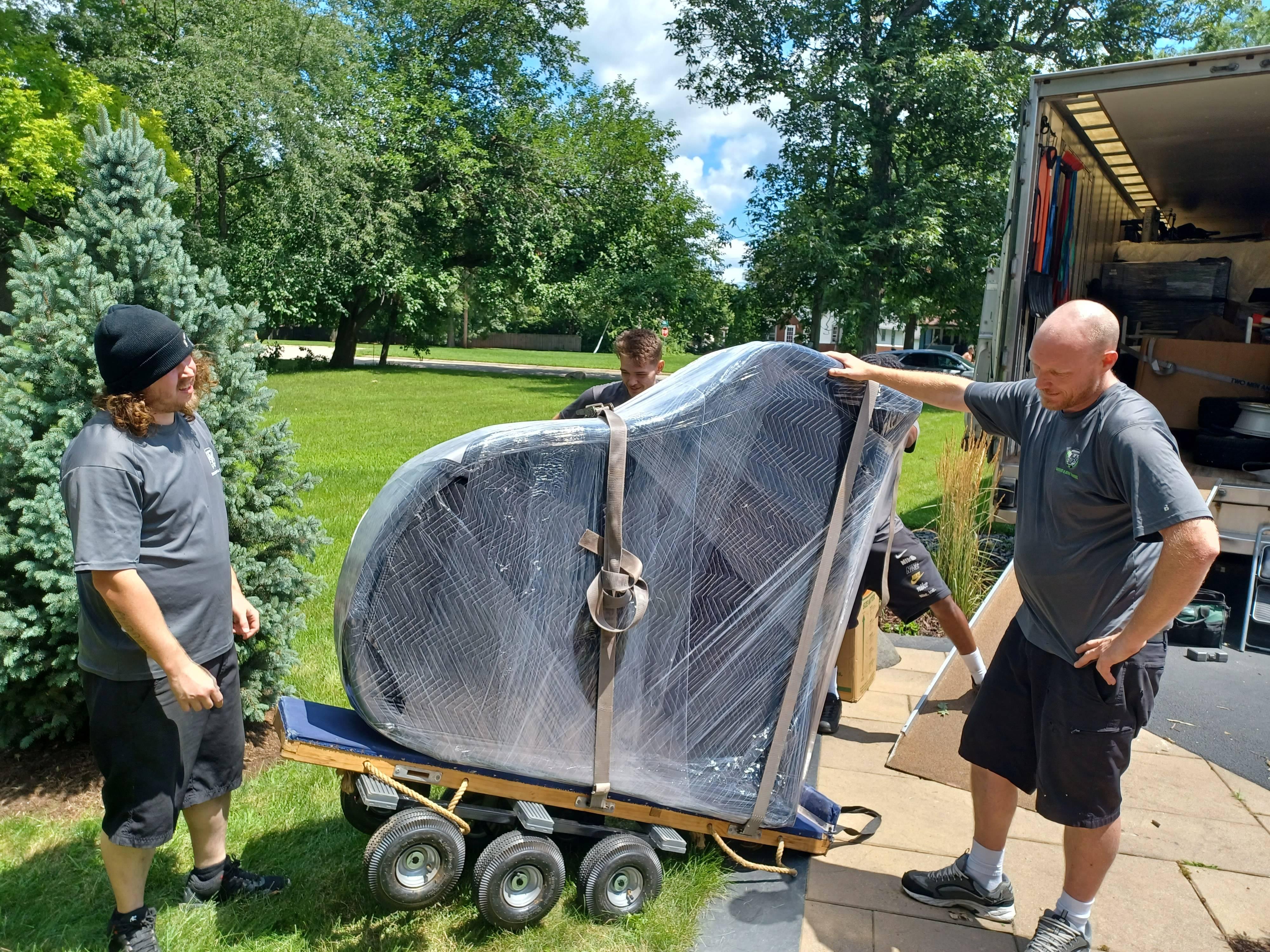 two men and a truck rockford il moving a grand piano