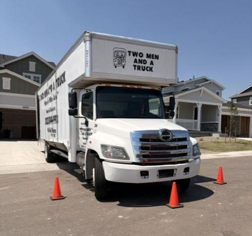 Moving truck parked with safety cones