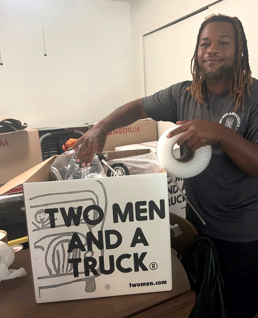 Mover packing a box